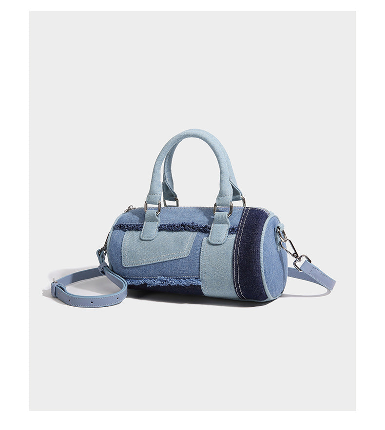 Mini barrel handbag in light and dark denim patchwork with frayed seam trim, dual top handles, top zip closure, and, detail