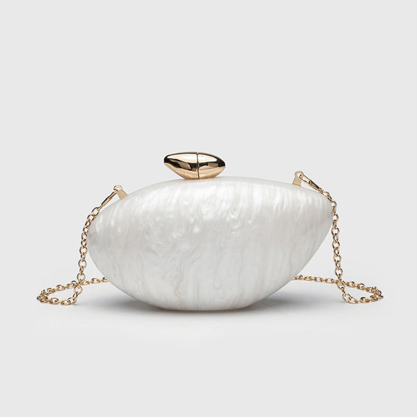 Oval hard-shell marbled gloss clutch bag with gold-tone kiss-lock clasp and detachable gold chain strap, front view