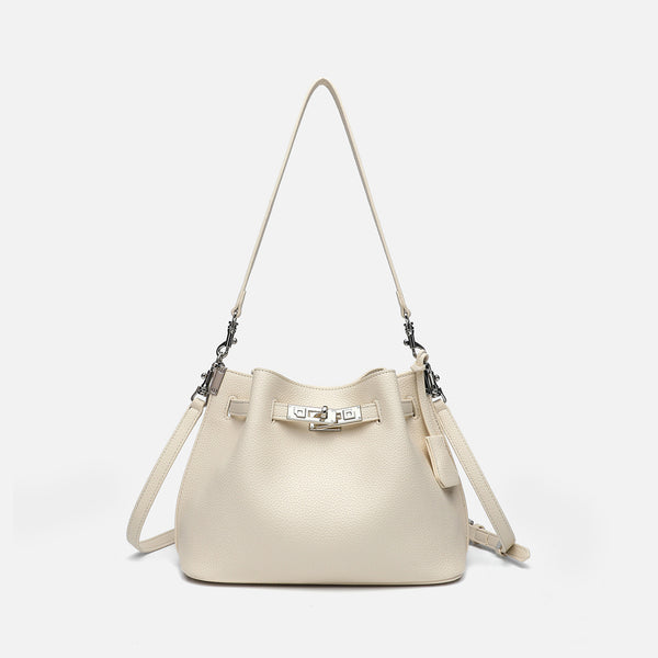 Soft-structured pebbled leather-look bucket bag with silver turn-lock front clasp and adjustable crossbody strap, front view