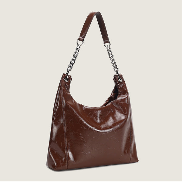 Glossy crinkled leather-look slouchy hobo bag with silver chain-and-leather shoulder strap and open top, detail view 3