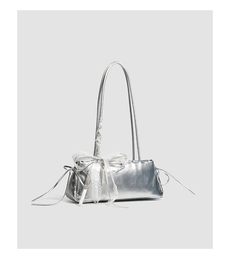 Compact glossy leather-look shoulder bag with lace bow and ribbon trim, detail view 17