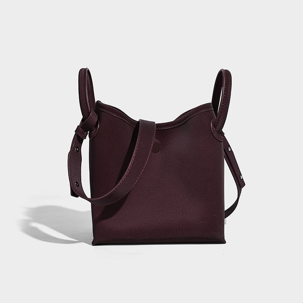 Small structured matte pebbled tote bag with twin top handles and removable zip pouch, detail view 3