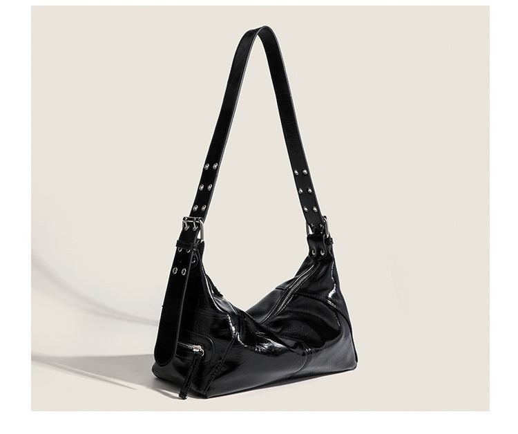 Glossy crinkled mini hobo shoulder bag with studded adjustable strap and silver-tone hardware, detail view 17