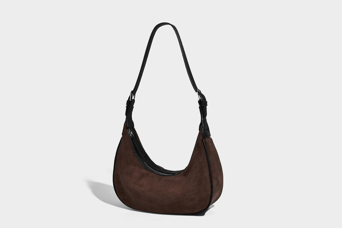 Crescent hobo shoulder bag in matte suede-look finish with black trim and adjustable strap, detail view 22