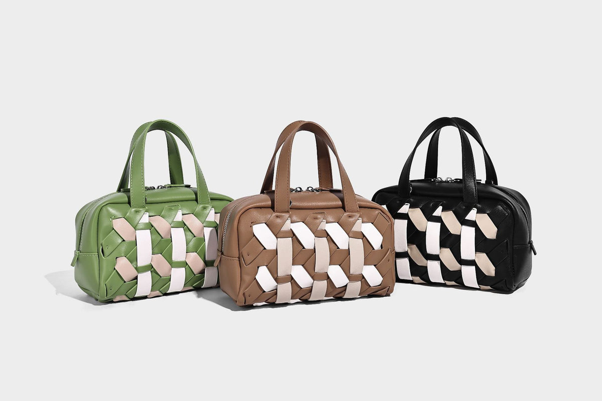 Small structured satchel bag with two-tone woven front panel, dual top handles, and detachable crossbody strap in tan brown