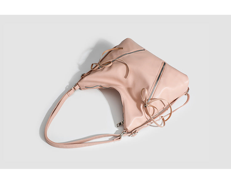 Slouchy hobo shoulder bag with bow detail and silver-tone hardware, detail view 9