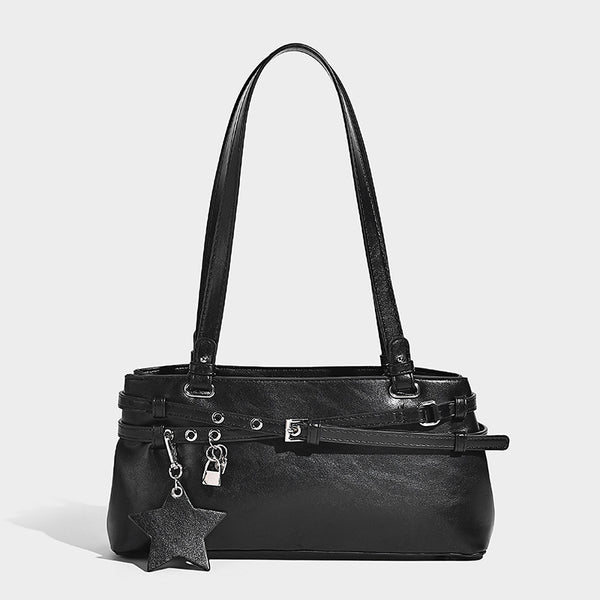 Structured glossy leather-look shoulder bag with wraparound belt straps, silver-tone hardware, and dangling star charm