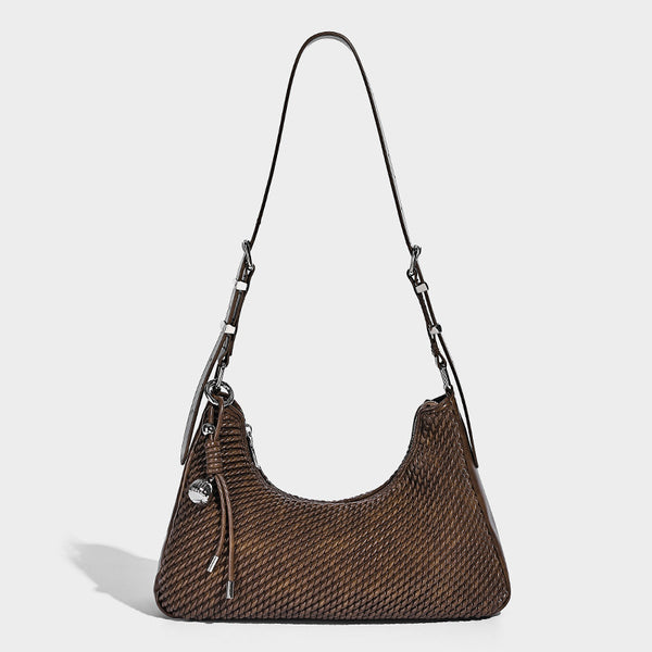 Woven crescent hobo shoulder bag with smooth side panels, zip-top closure, silver-tone charm hardware, and adjustable, detail