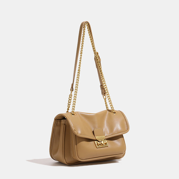 Smooth leather-look flap crossbody bag with chunky gold-tone chain strap and double-knob twist lock, detail view 3