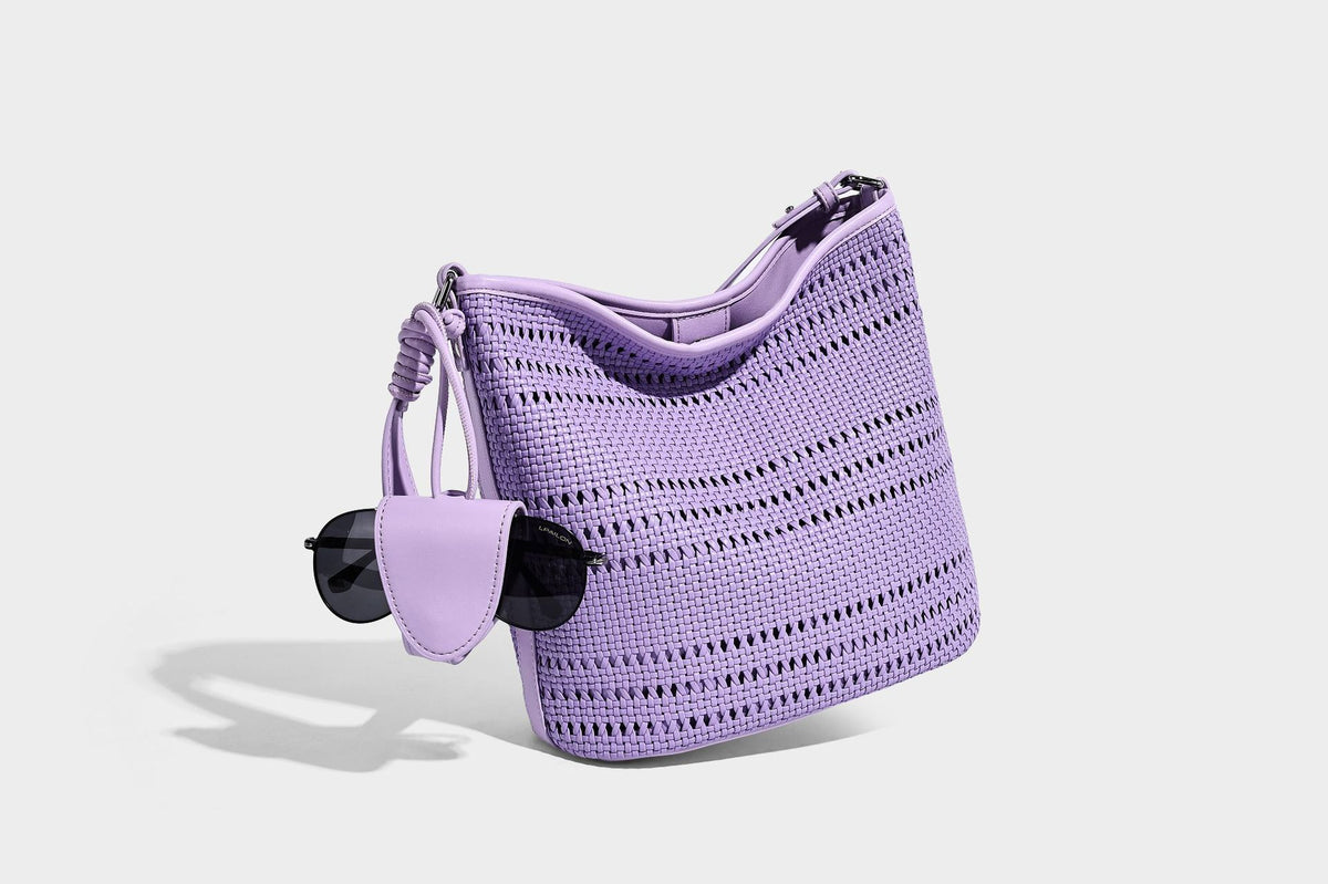 Handwoven open-weave shoulder bag with leather-look trim, knotted adjustable strap, and clip-on sunglasses sleeve pouch
