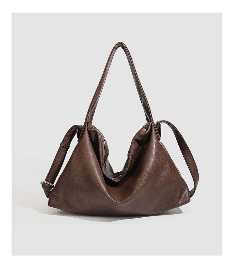 Slouchy leather-look hobo shoulder bag with top zipper and silver-tone hardware, detail view 7
