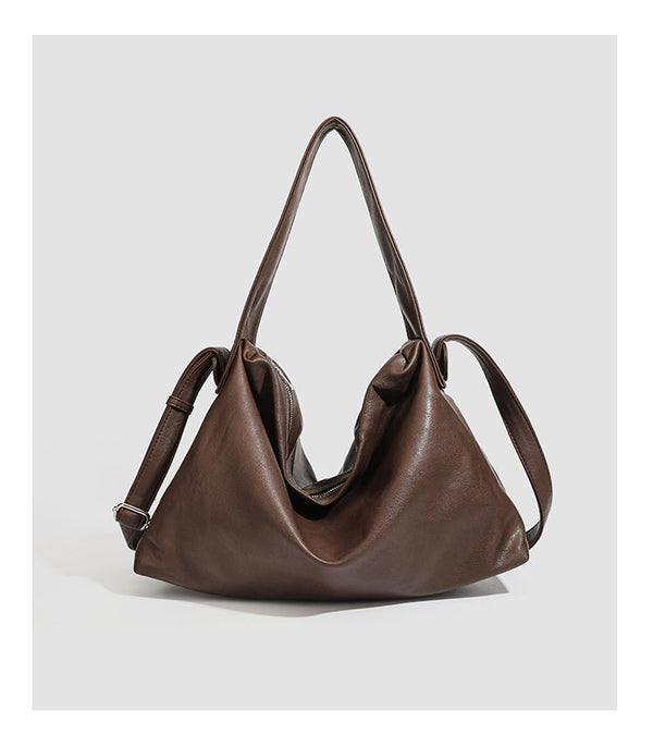 Slouchy leather-look hobo shoulder bag with top zipper and silver-tone hardware, detail view 7