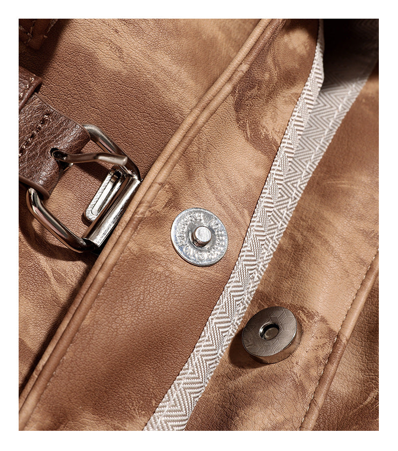 Compact distressed leather-look tan-brown backpack handbag with flap-and-buckle closure, two front patch pockets, top handle