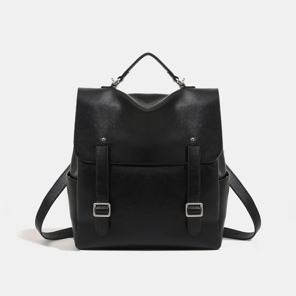 Structured flap backpack handbag in smooth leather-look finish with buckle front pocket, top handle, and silver-tone