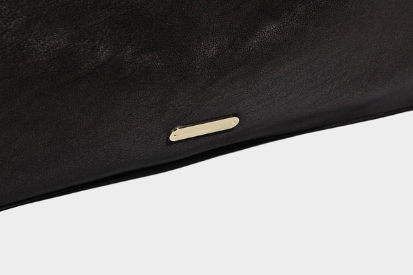 Large slouchy hobo shoulder bag in matte leather-look finish with adjustable strap and gold-tone bar hardware, detail view 21