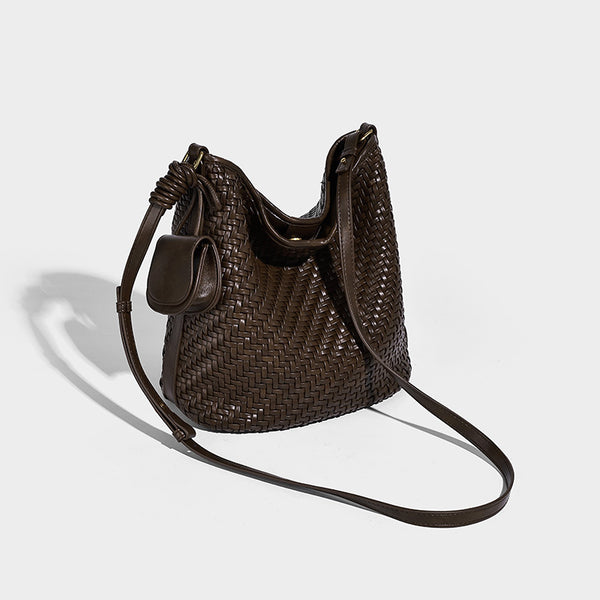 Woven leather-look bucket bag with basket-weave texture, attached mini pouch, and adjustable shoulder strap, detail view 3