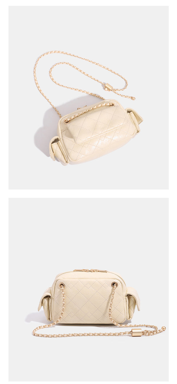 Compact quilted diamond-stitch crossbody bag with gold-tone chain strap and top zip closure, detail view 13