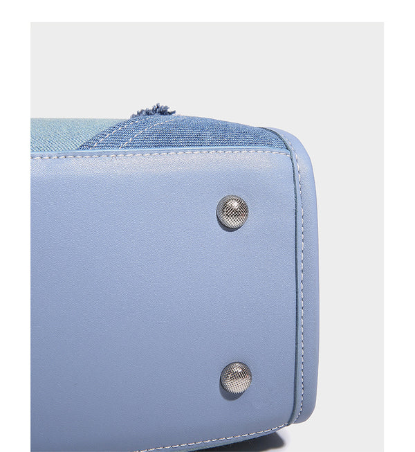 Structured patchwork denim tote bag with frayed panel seams, dual top handles, and silver-tone hardware, detail view 12