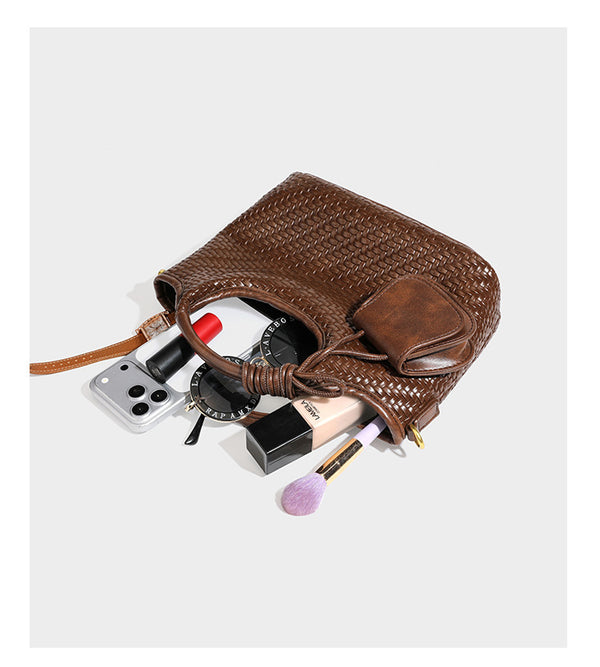 Woven leather-look tote bag in mocha brown with knotted top handle, front flap pocket, and detachable crossbody strap with
