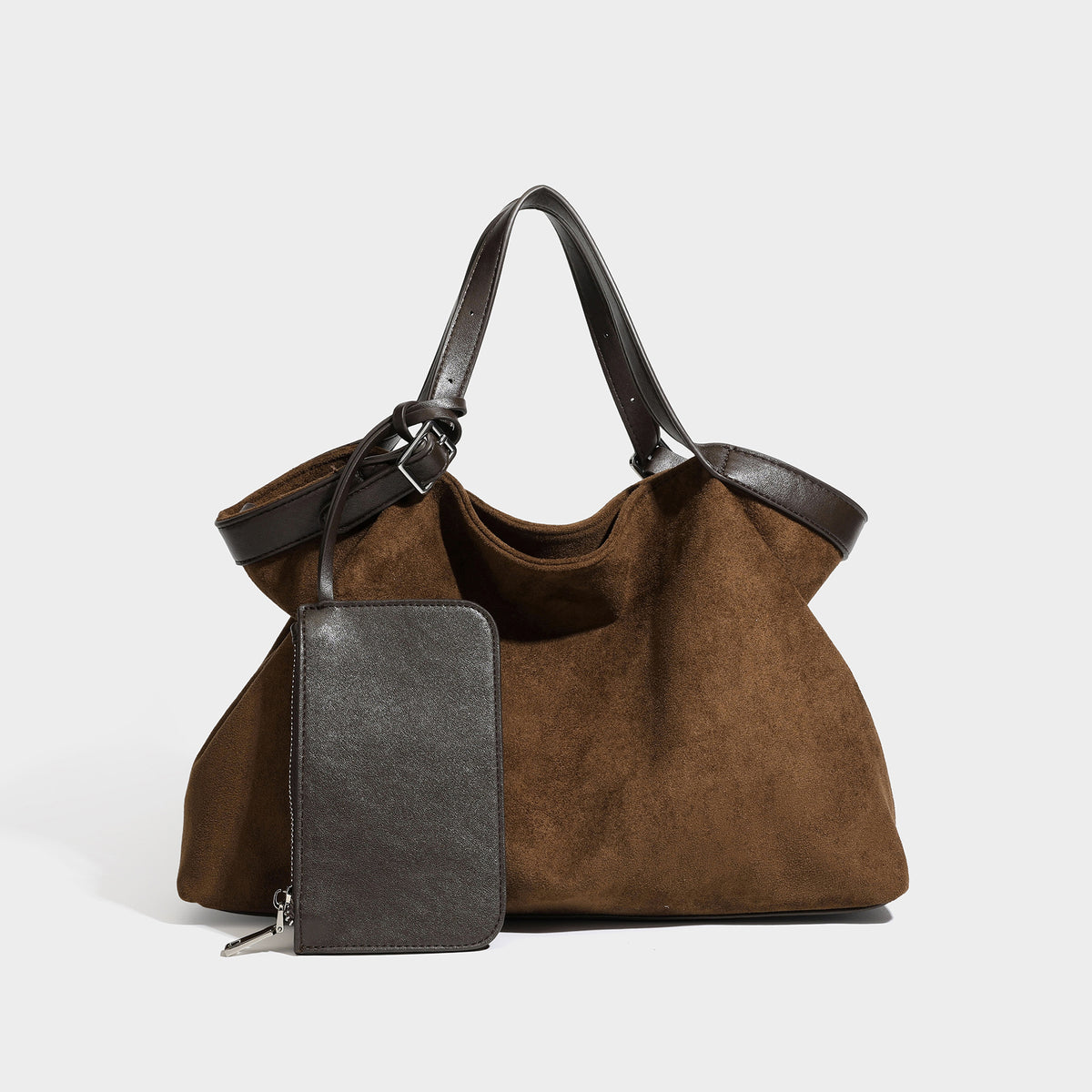 Large slouchy suede-look tote bag in warm brown with dark smooth trim, dual top handles, detachable zip pouch, and, front