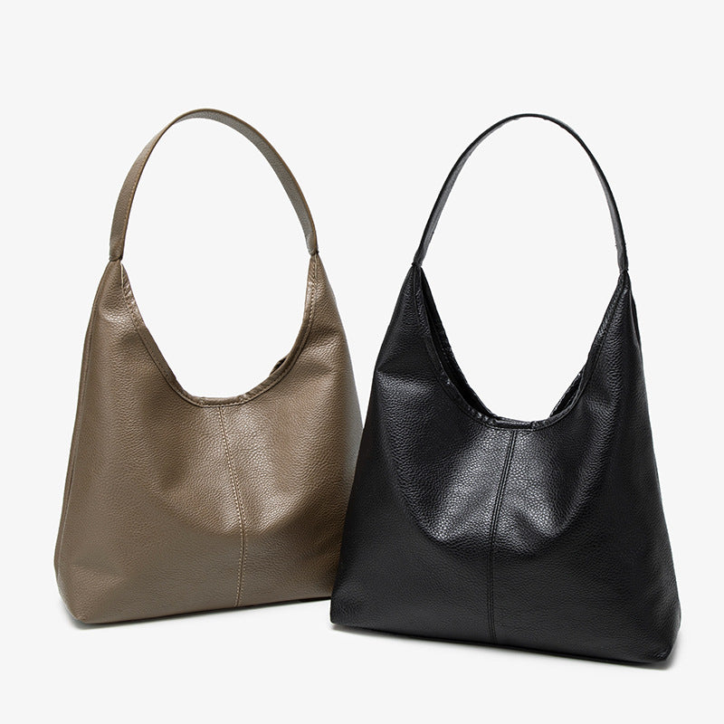 Large slouchy hobo shoulder bag in pebbled matte leather-look finish with single flat strap, detail view 2