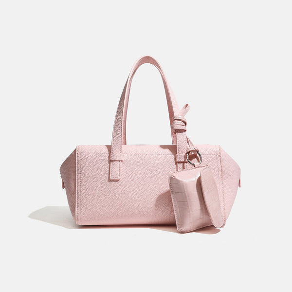 Structured pebbled leather-look top-zip barrel bag with dual handles, detachable shoulder strap, and attached croc-pattern