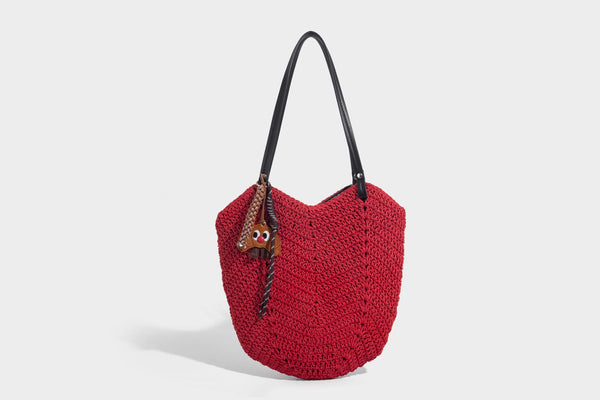 Woven crochet open-top shoulder tote bag with slim brown leather-look straps and braided charm accent, detail view 17