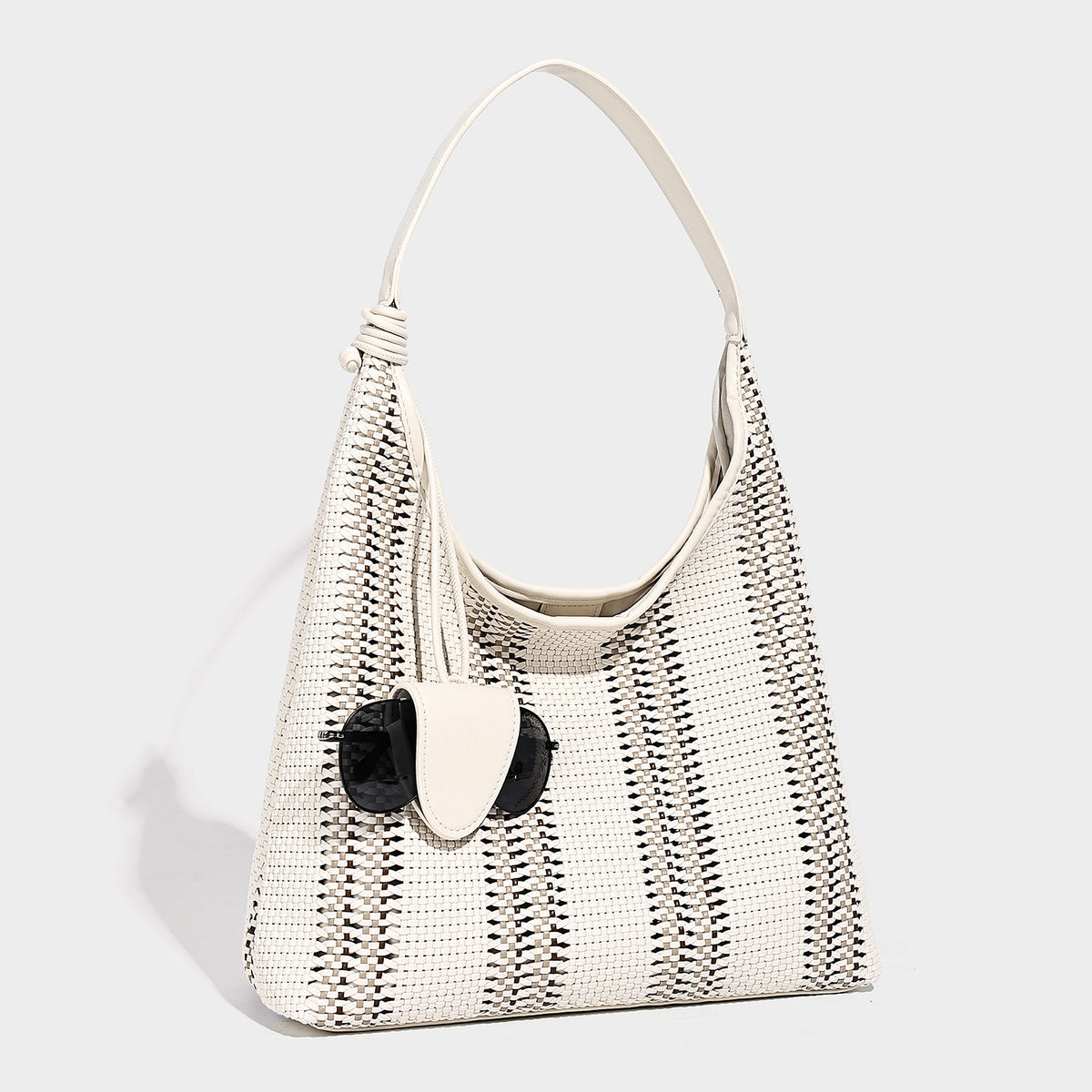 Woven striped slouch shoulder tote bag with knotted strap and attached front flap pouch, detail view 13