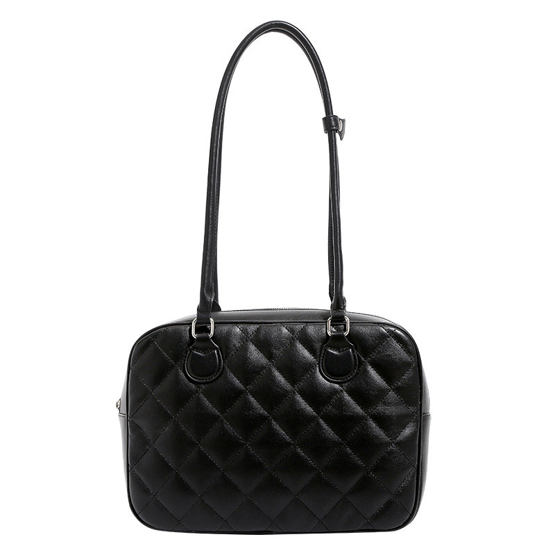 Structured diamond-quilted bowling shoulder bag with silver-tone hardware and top zip closure, detail view 5