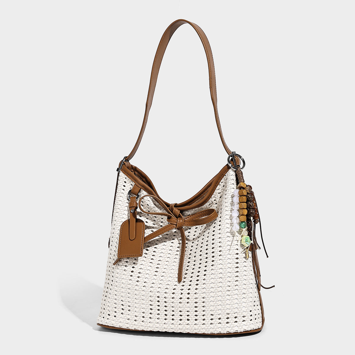 Slouchy open-weave shoulder tote bag with leather-look tan trim, tie-front closure, and long adjustable strap, detail view 4