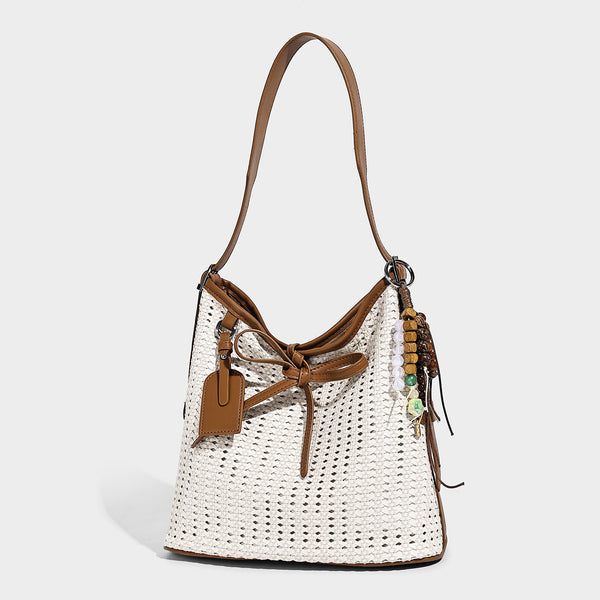 Slouchy open-weave shoulder tote bag with leather-look tan trim, tie-front closure, and long adjustable strap, detail view 4
