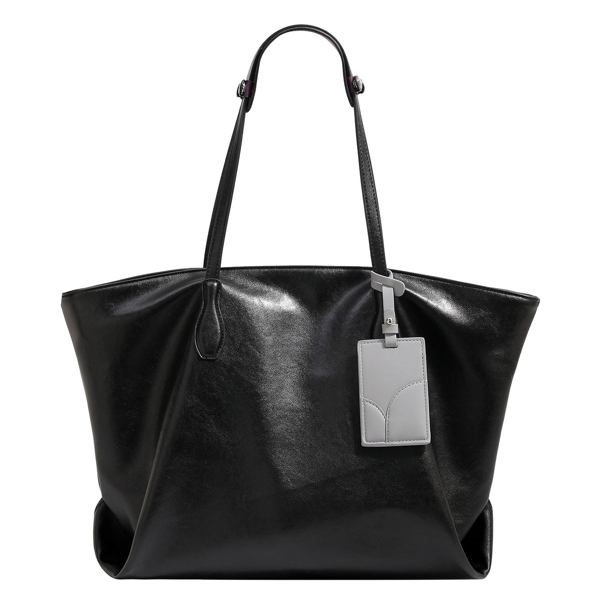 Large soft trapezoid tote bag with leather-look finish, dual shoulder straps, and gray hanging card tag, detail view 5