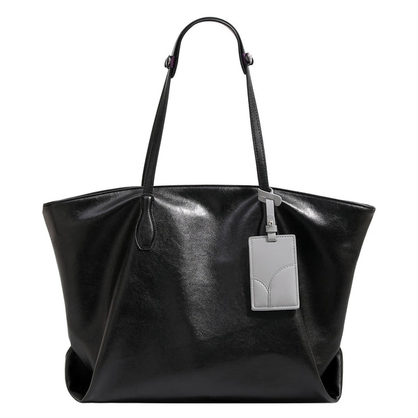 Large soft trapezoid tote bag with leather-look finish, dual shoulder straps, and gray hanging card tag, detail view 5