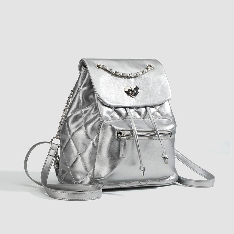 Quilted leather-look backpack with heart turn-lock clasp and woven chain handles, detail view 3