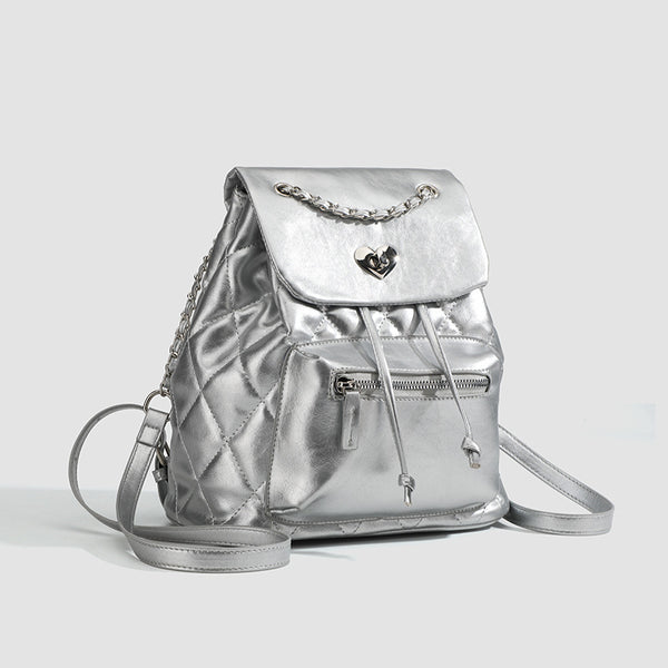 Quilted leather-look backpack with heart turn-lock clasp and woven chain handles, detail view 3