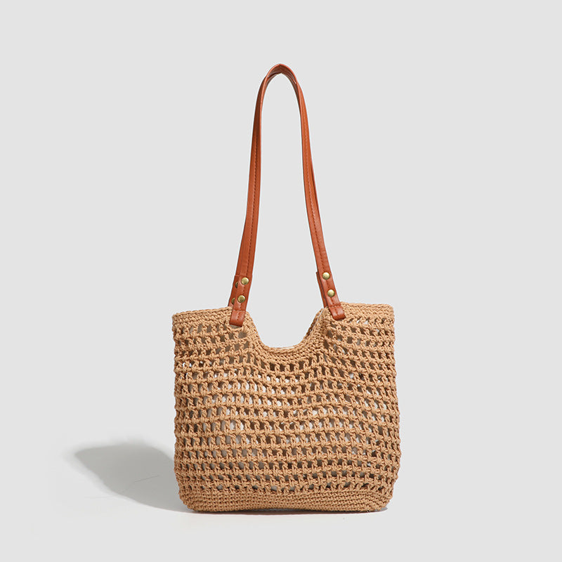 Open-knit woven tote bag with leather-look shoulder straps and brass-tone hardware in off-white, detail view 8