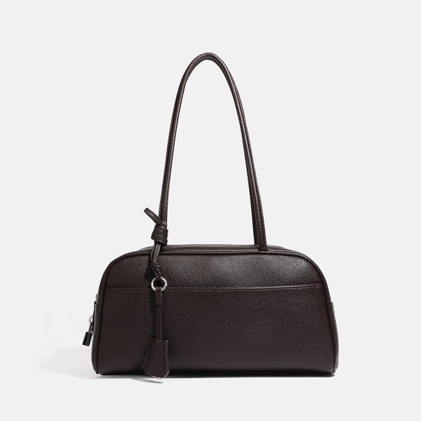 Structured rounded rectangular shoulder bag with pebbled leather-look finish, dual long handles, top zipper, front zip