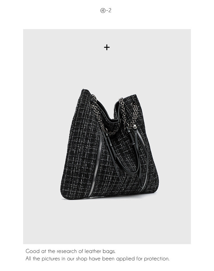 Große schwarze Schulter-Tote-Bag mit Tweedstruktur, silberfarbener Kette und Riemen in Lederoptik, Metallösen und Außenreißverschluss