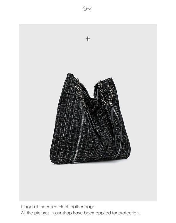 Große schwarze Schulter-Tote-Bag mit Tweedstruktur, silberfarbener Kette und Riemen in Lederoptik, Metallösen und Außenreißverschluss