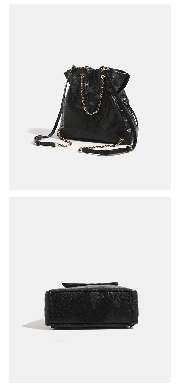 Quilted crinkled leather-look convertible tote backpack with gold-tone chain handles and drawstring closure, detail view 11