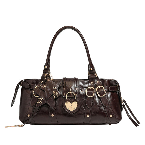 Dark brown glossy crinkled leather-look barrel bag with gold heart lock, dome studs, star charm, dual top handles and, detail
