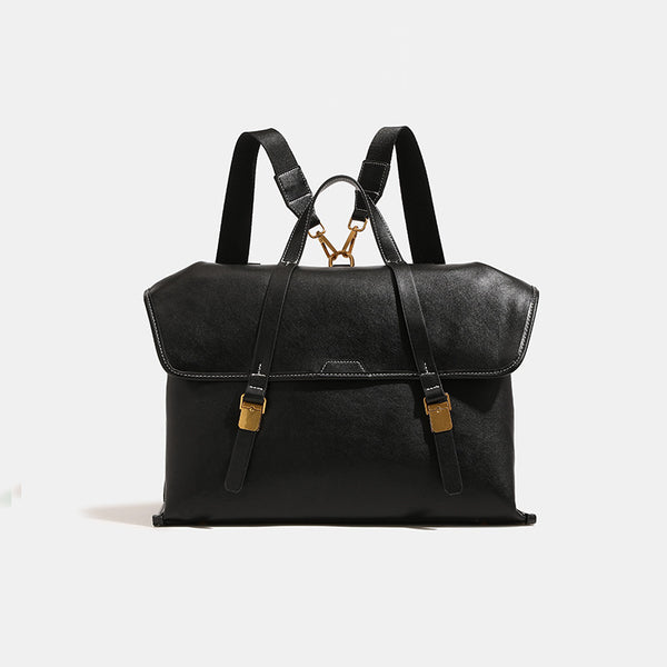 Strukturierter wandelbarer Rucksack im Denim-Look mit Besatz in Cognac-Lederoptik, goldfarbenen Schnallen und Tragegriff an der Oberseite