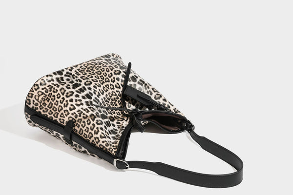 Slouchy leopard print shoulder hobo bag with black leather-look trim, tie-top closure, and single long strap, detail view 36