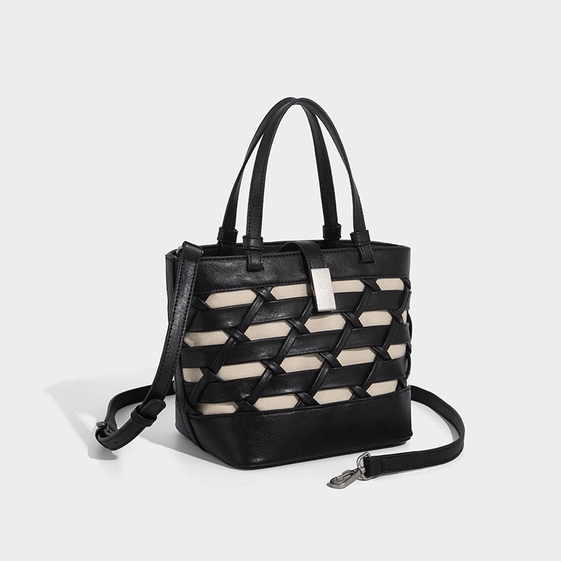 Structured woven lattice tote bag with cream lining, dual top handles, detachable crossbody strap, and silver-tone hardware