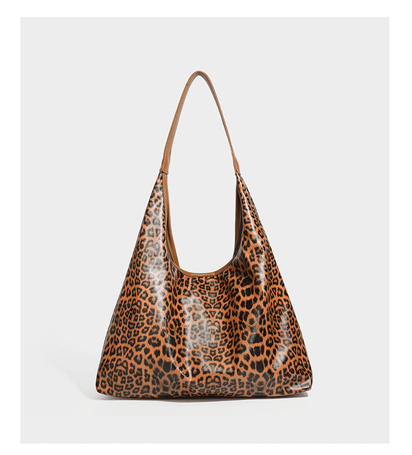 Glossy leopard-print slouchy shoulder bag with long strap and detachable tan zip pouch, detail view 13