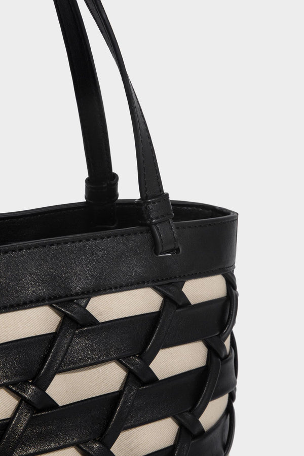 Structured woven lattice tote bag with cream lining, dual top handles, detachable crossbody strap, and silver-tone hardware