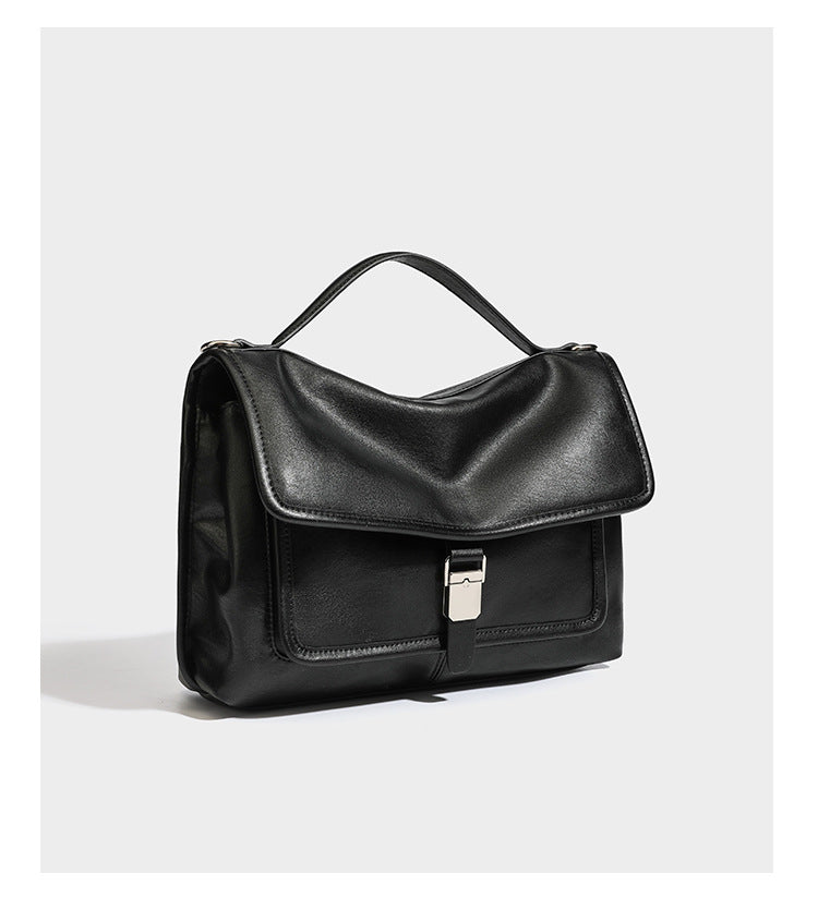 Structured rectangular flap satchel in espresso brown leather-look finish with silver-tone turn-lock buckle, top handle, and
