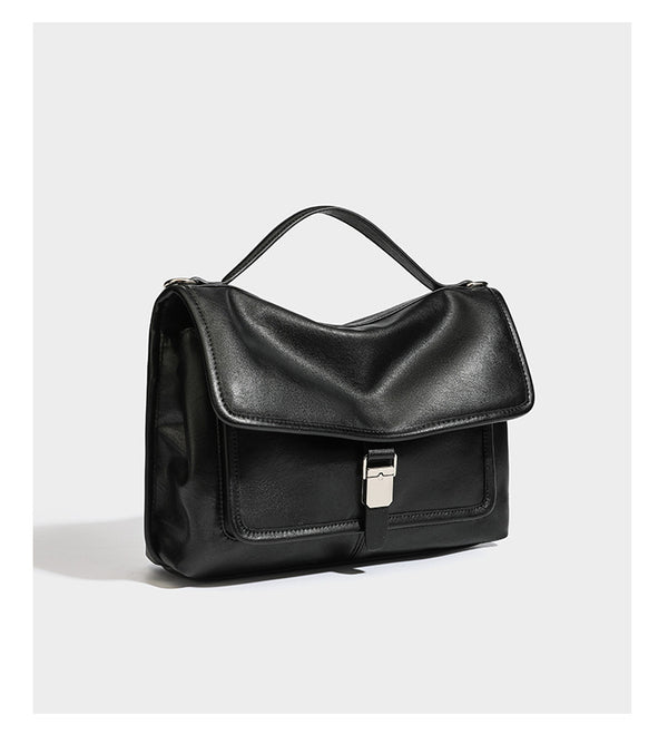 Structured rectangular flap satchel in espresso brown leather-look finish with silver-tone turn-lock buckle, top handle, and