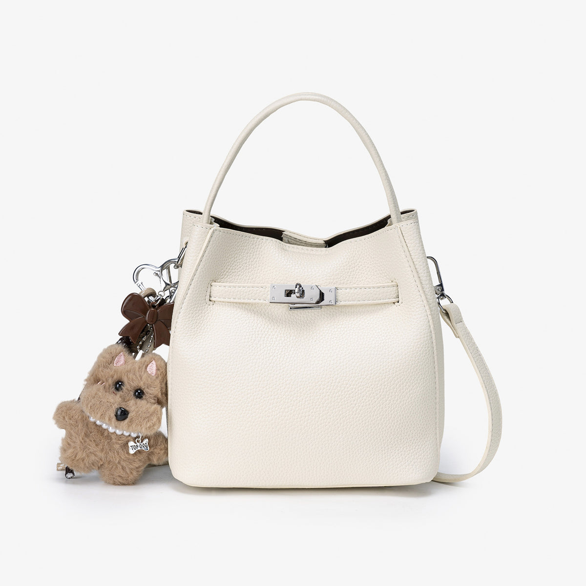 Compact structured bucket bag in pebbled leather-look finish with silver turn-lock front clasp, dual top handles, detachable