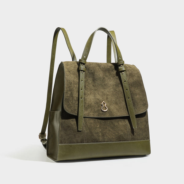 Structured suede-look convertible backpack handbag with flap closure and gold-tone emblem hardware in chocolate brown, detail